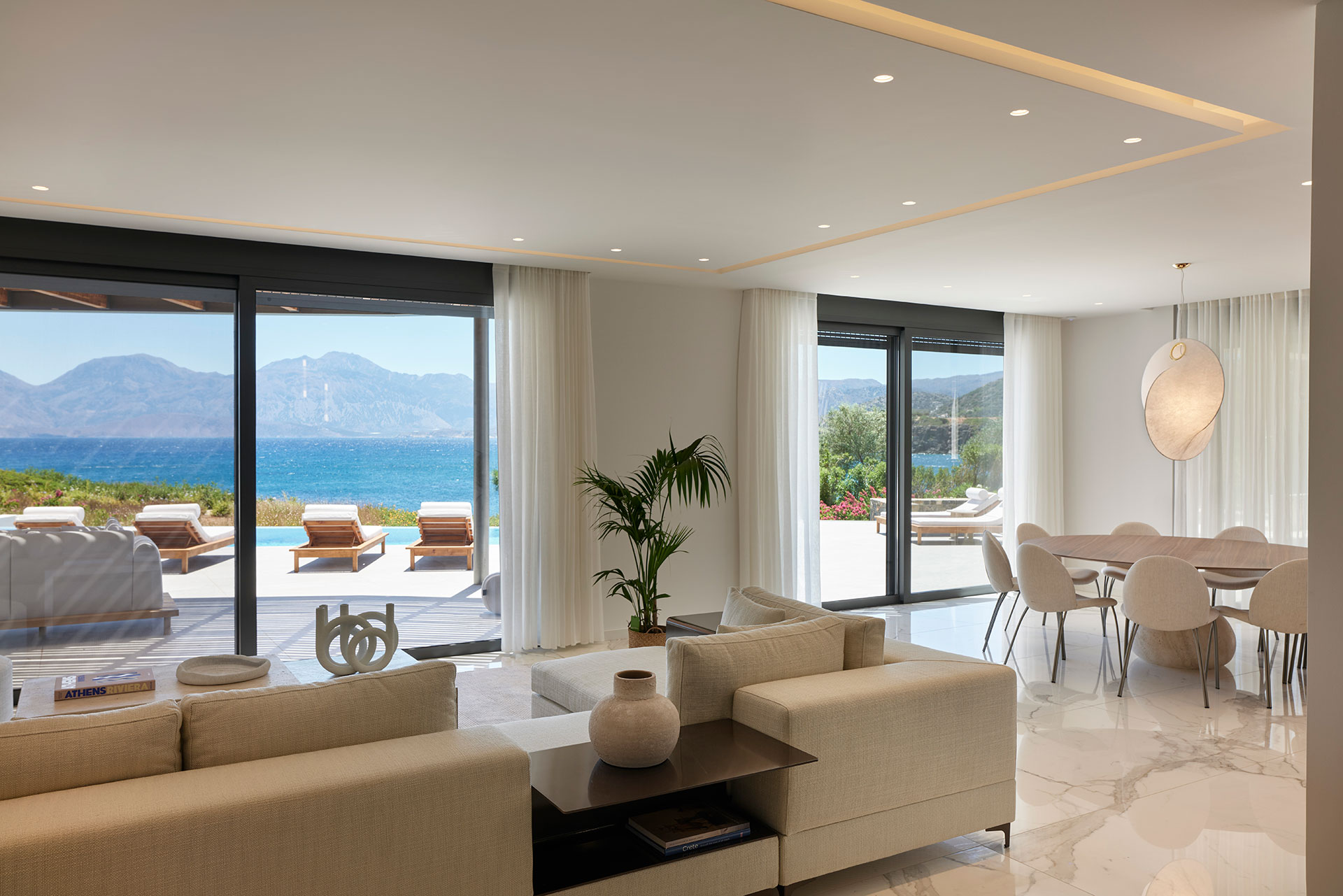 Iremia Seafront Villa Dining Area & Living Room with Floor to Ceiling Sea 